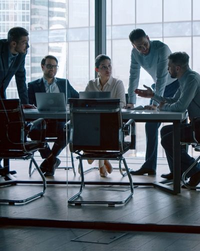 Five employees having a meeting